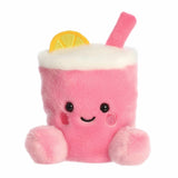 Plush toy resembling a pink drink with a lemon slice and straw on a white background
