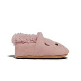 Pink baby bootie with fluffy top on a white background