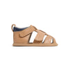 Tan baby sandal with a white background
