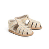 Pair of baby sandals with floral pattern on a white background