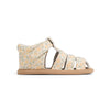 Floral-patterned sandal on a white background
