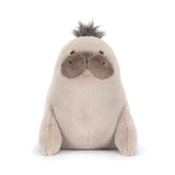 Plush toy otter on a white background