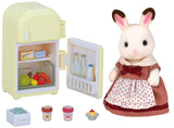 Toy rabbit figure with a small refrigerator set on a white background