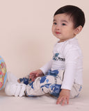 Child wearing the Tiny Tribe World Tour Set outdoors.