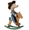 Toy mouse in cowboy outfit riding a wooden rocking horse on a white background
