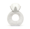 Gray textured ring with a white ball on top against a white background