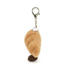 Plush keychain shaped like a doggy paw with a clip on a white background