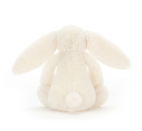 Cream-colored bunny toy on a white background