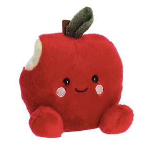 Plush toy shaped like a red apple with a smiling face on a white background