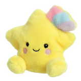 Yellow plush star toy with a rainbow tuft on a white background