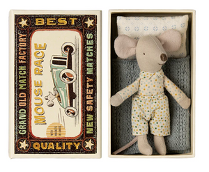 Small stuffed mouse toy in a matchbox with a vintage-style matchbox design.