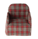 Plaid-patterned chair with red and gray colors on a white background