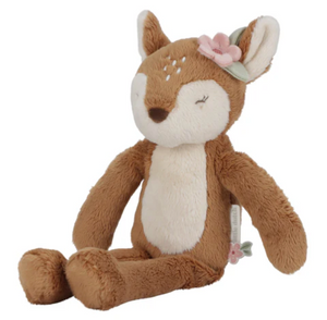 Plush deer toy with a flower on a white background