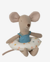 Stuffed mouse toy with a blue dress and polka dot cushion on a white background