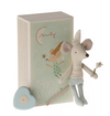 Stuffed mouse toy with a heart-shaped object and a decorative box on a white background