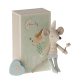 Stuffed mouse toy with a heart-shaped object and a decorative box on a white background