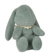 Green plush bunny toy with a white lace collar on a white background