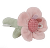 Pink plush flower toy with a green stem on a white background