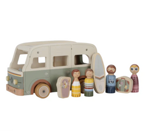 Wooden toy family with a vintage-style car on a white background