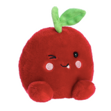 Plush toy shaped like a red apple with a smiling face on a white background