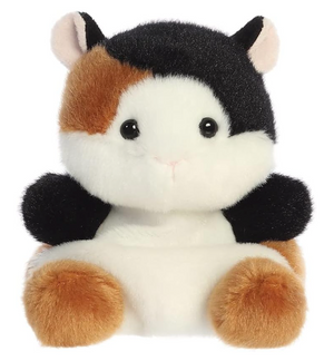 Plush toy resembling a calico cat on a white background