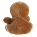 Brown plush duck toy on a white background