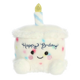 Plush toy shaped like a birthday cake with a candle and 'Happy B-day' text on a white background