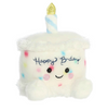 Plush toy shaped like a birthday cake with a candle and 'Happy Birthday' text on a white background