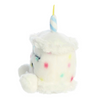 Plush toy resembling a unicorn with colorful sprinkles on a white background