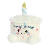 Plush toy shaped like a birthday cake with a candle and 'Happy B-day' text on a white background