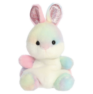 Pastel-colored plush bunny toy with glittery ears on a white background