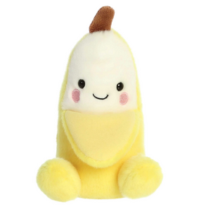 Plush toy shaped like a banana with a smiling face on a white background