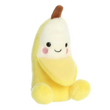Plush toy shaped like a banana with a smiling face on a white background