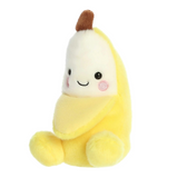 Plush toy shaped like a banana with a smiling face on a white background