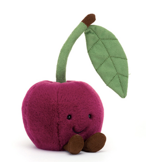 Plush toy cherry with a green leaf on a white background
