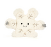White plush toy with snowflake patterns on a white background