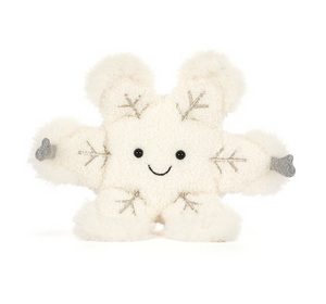 White plush toy with snowflake patterns on a white background