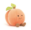 Plush toy shaped like a peach with a smiling face on a white background