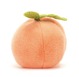 Plush toy shaped like a peach on a white background