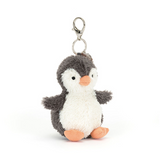 Plush penguin keychain on a white background