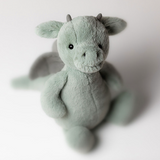 Plush dragon toy on a white background