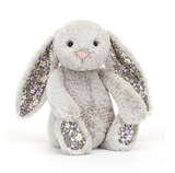 Plush bunny toy with floral ears on a white background