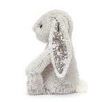 Plush bunny toy with floral ear on a white background