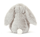Fluffy gray bunny plush toy on a white background