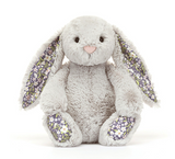 Plush bunny toy with floral ears and feet on a white background