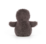 Plush toy penguin on a white background