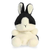 Black and white plush bunny toy on a white background