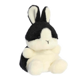 Black and white plush bunny toy on a white background
