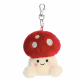 Plush mushroom keychain with a red cap and white spots on a white background