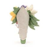 Toy carrot with a bouquet of flowers on a white background